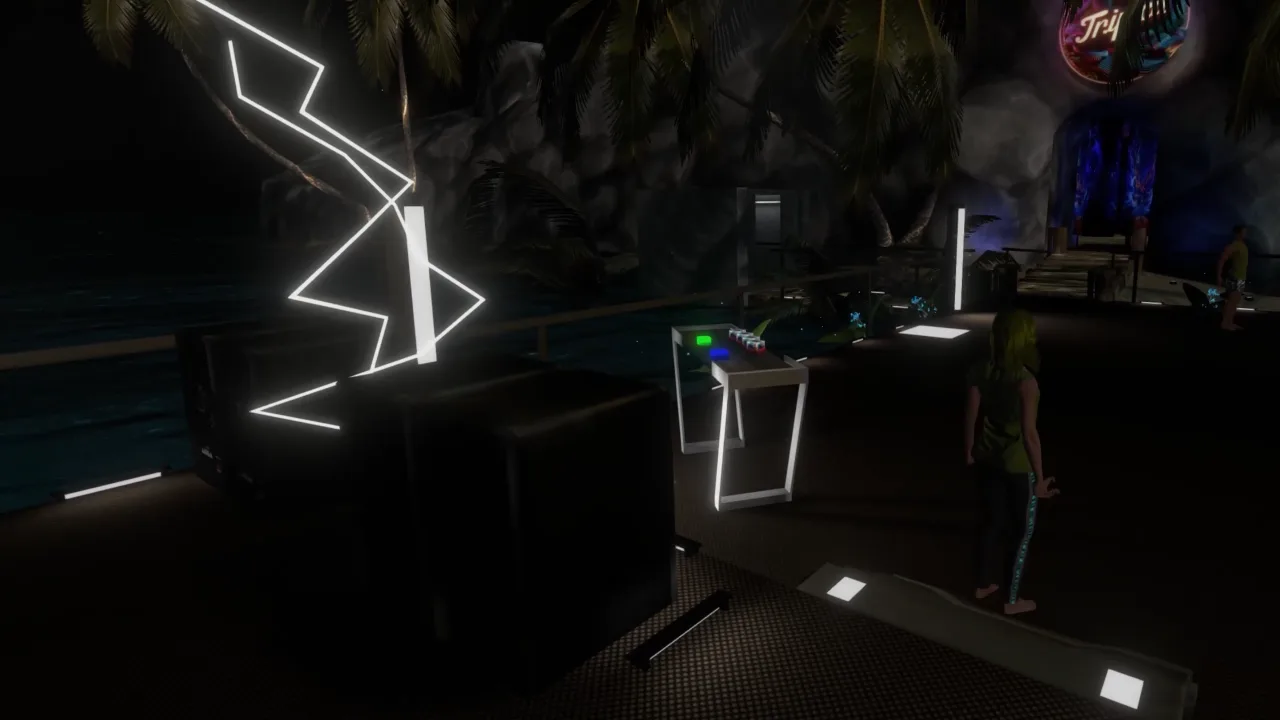 Neon lights and the DJ booth inside the volcano caves
